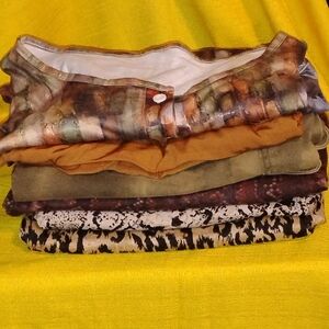 Women'sWear - 2 Tops - Mid Length Sleeves, 1 Pant, 2 Capri Pants, 1 Jeans Skirt.